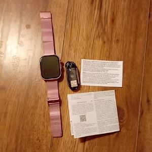 Elegant Pink Smartwatch with USB Charger